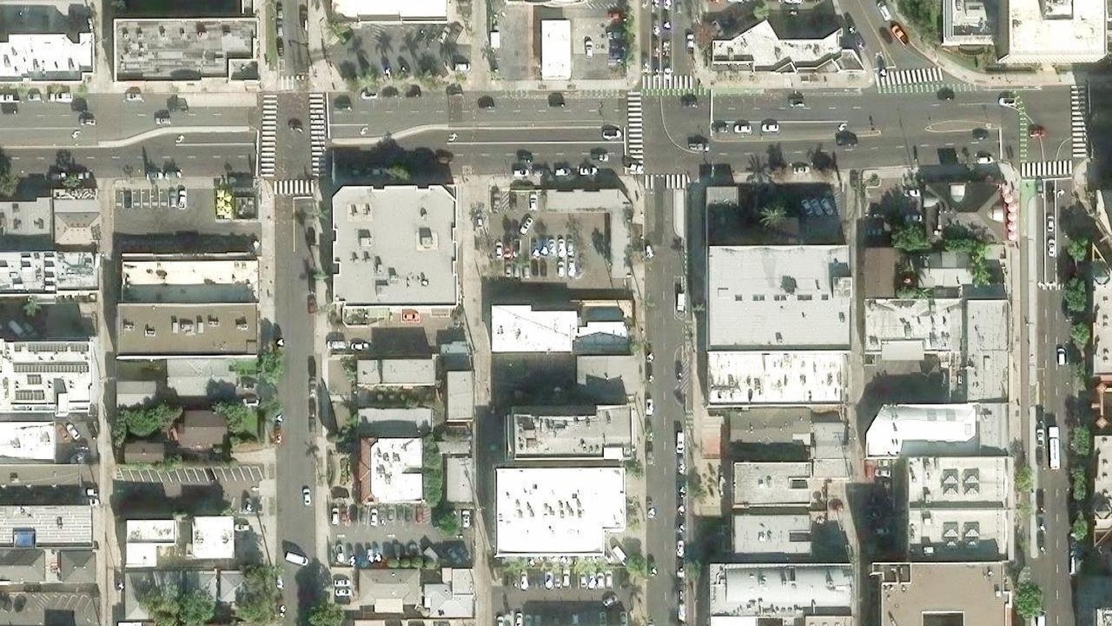 High-resolution satellite aerial view of the 4325 6th Avenue parcel and surrounding Hillcrest blocks, with 6th Avenue running north and University Avenue crossing east-west